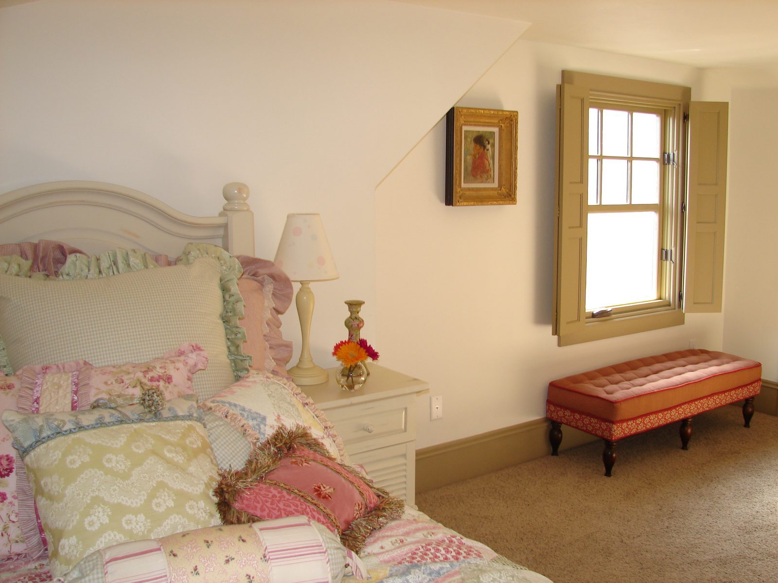 Finished bedroom with a window, painted walls and carpet