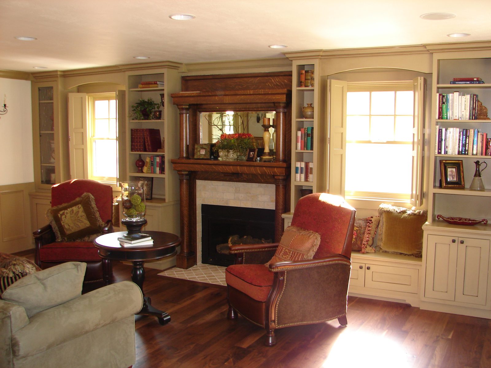 Living room after renovation with a rebuilt fireplace and flanking built-in bookcases