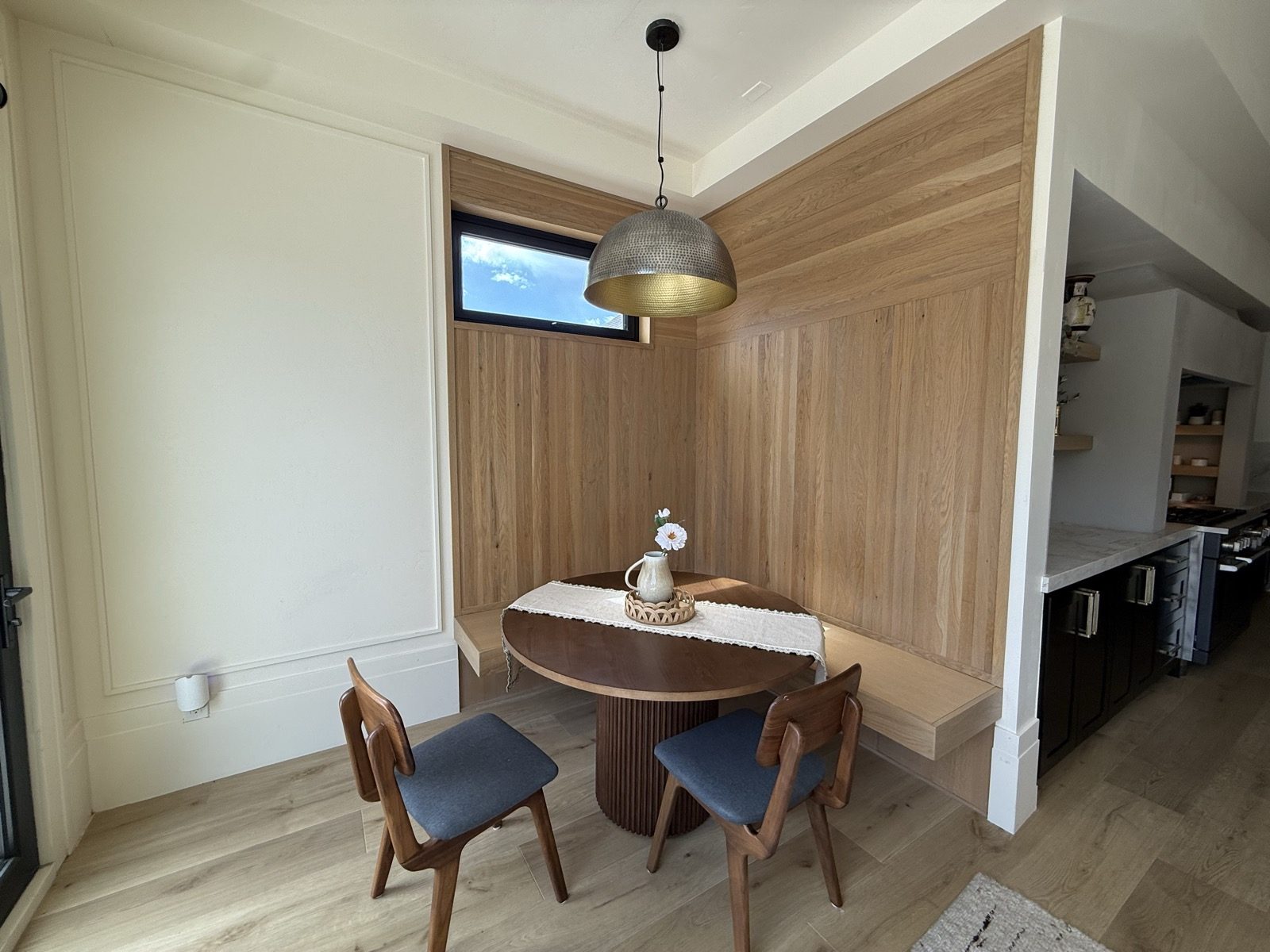 A built in white oak breakfast nook