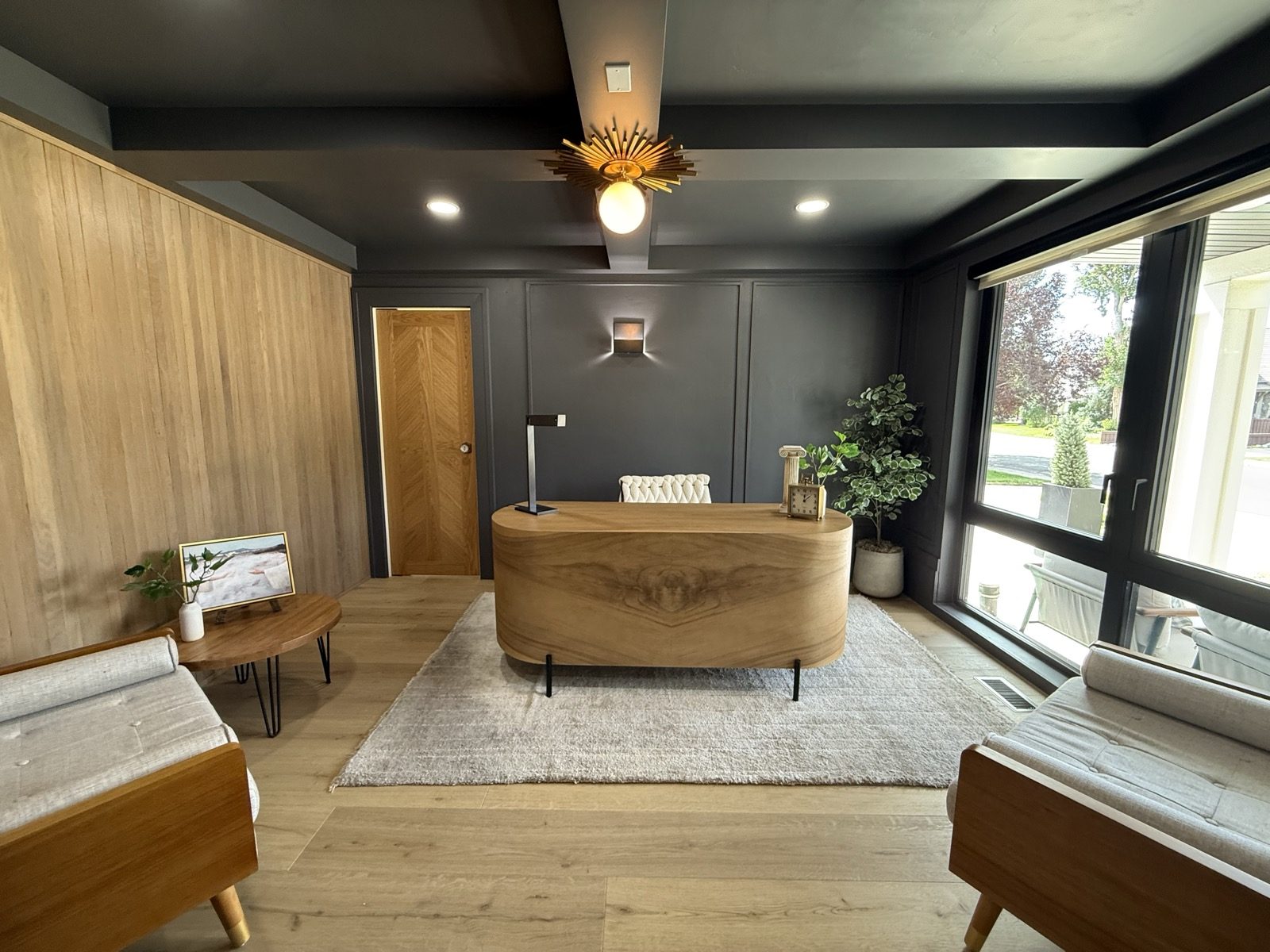 A moody, dark-toned home office in a remodeled Provo home