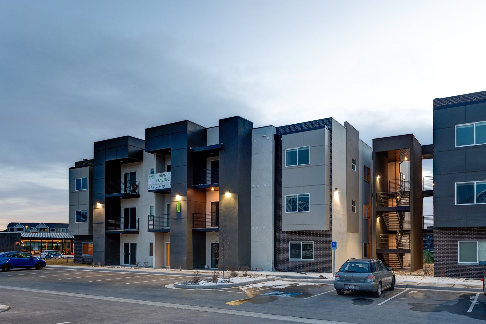 Street view of the apartment buildings at The Vine at dusk
